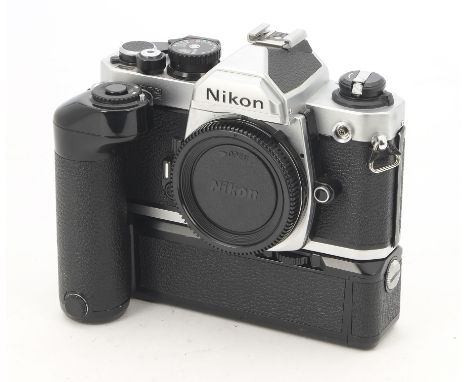 A Nikon FM2 SLR Body, serial no. 7277855, chrome, shutter working, body, G-VG, minor paint chips to film door, with maker's b