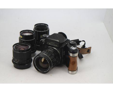 A Asahi Pentax 6X7 SLR Camera Oufit, serial no. 4108829, body G, wooden handle grip, with lenses; a SMC Takumar/6x7 75mm f/4.