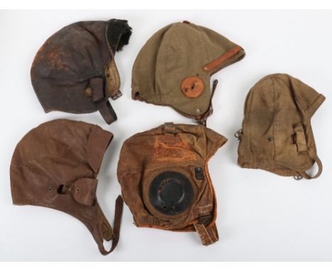 1930s Flying Helmets: Two cotton light weight helmets complete with buckles and straps and three leather helmets complete wit