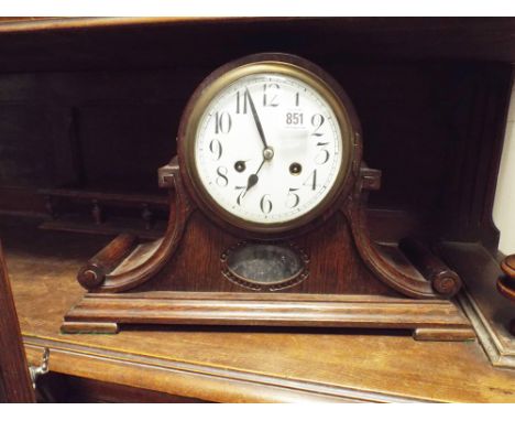 Oak Napoleon cased striking mantel clock with white enamel dial 