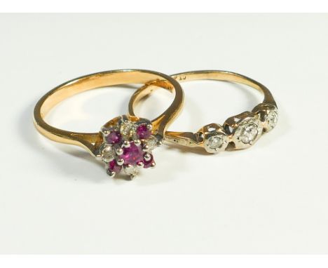 18ct gold ruby and diamond cluster ring and a small 3 stone diamond ring on 18ct gold shank 