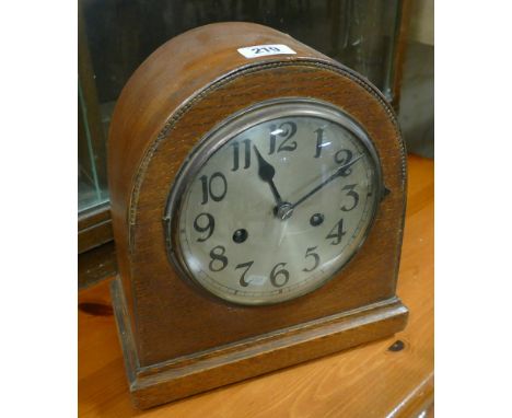 Oak cased arched case mantel clock 