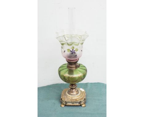 Victorian brass oil lamp with decorative green and gilt glass bowl and floral decorated shade 