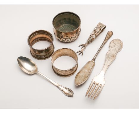 A collection of small silver ware - two napkin rings, salt cellar, Norwegian fork and other cutlery