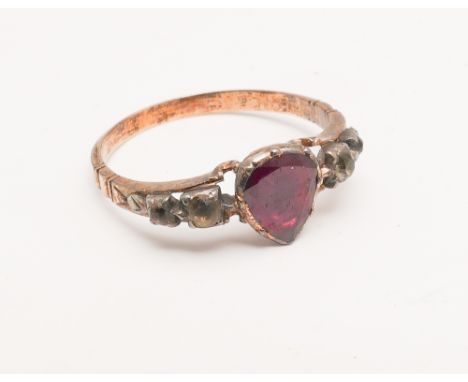 Antique ruby and diamond ring set with heart shaped foil backed ruby flanked by small old cut diamonds, unmarked clasp Ring s