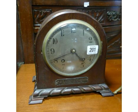 Striking mantel clock in dome topped mahogany case 