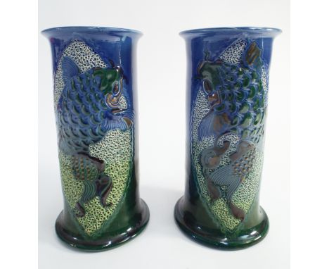 Pair of Charles Brannam Royal Barum Ware art nouveau cylindrical vases decorated with Koi fish.  Impressed marks.  Height 19c