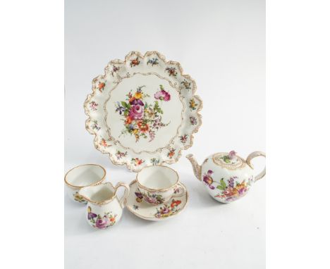 Dresden porcelain floral decorated cabaret set on tray comprising circular shaped edge tray, matching teapot, cup and saucer 