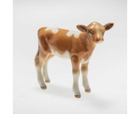 A BESWICK MODEL OF A GUERNSEY CALF golden brown and white gloss, model no. 1249A. 7cm highLight crazing. In otherwise good co