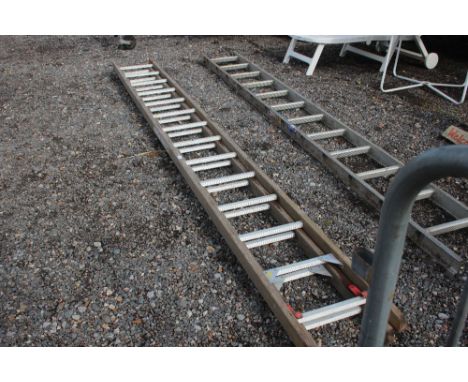 A wooden and metal extending ladder