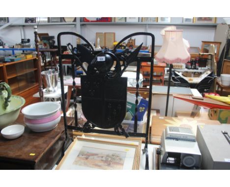 A wrought iron fire screen 
