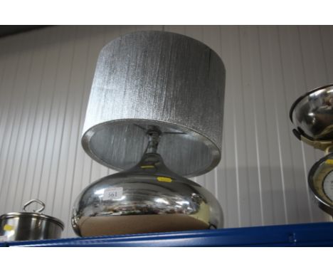 A chrome table lamp with silver shade