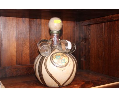 A continental decanter with a set of four glasses