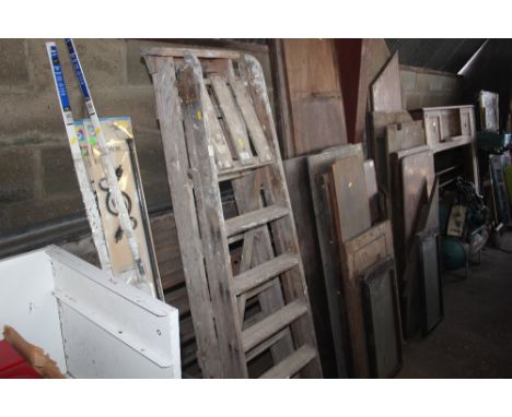 Two wooden step ladders