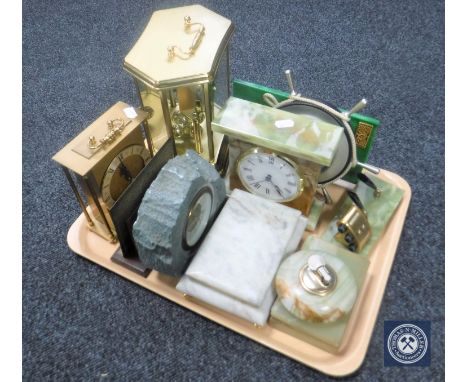 A tray containing onyx mantel clock, cigarette box and table lighter, battery operated brass carriage clock, ships wheel baro