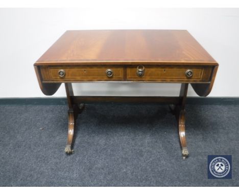 A Regency style sofa table fitted two drawers 