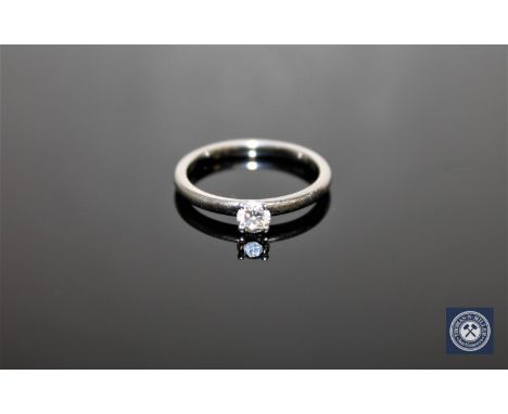 A platinum diamond solitaire ring, size M CONDITION REPORT: The ring is in good condition. The brilliant-cut stone weighs app