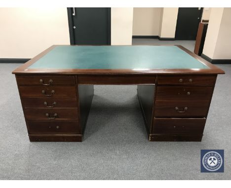 A mahogany partner's desk with inset panel 