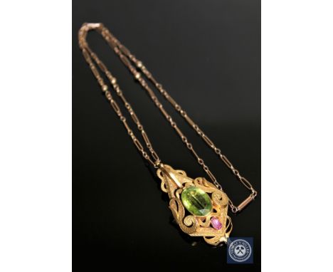 A superb quality antique 15ct gold peridot and ruby pendant with chain