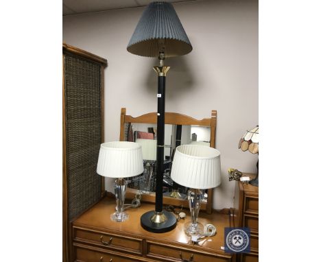 A floor lamp with shade and a pair of table lamps with shades 