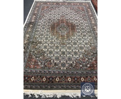 A Tabriz design carpet on cream ground, 362 cm x 246 cm