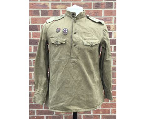 A scarce WW2 era Soviet Russian summer weight tanker jacket, with 2 enamel badges applied to the right breast. Olive drab gre