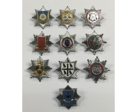 A good selection of vintage chromed and enamelled fire service cap badges. To include: GMC Fire Service, Coventry City Fire S