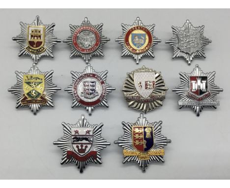 A selection of vintage chromed and enamelled fire service cap badges. To include: Great Yarmouth Fire Brigade, Carlow County 