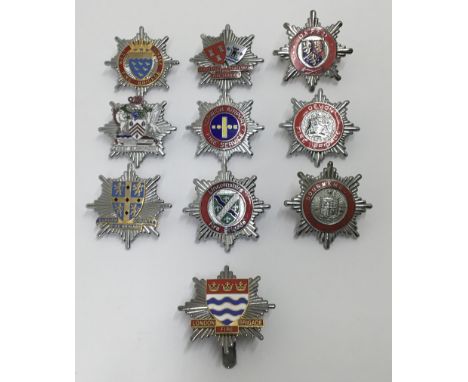 A selection of vintage chromed and enamelled fire service cap badges. To include: Bournemouth Fire Brigade, Devon Fire Brigad