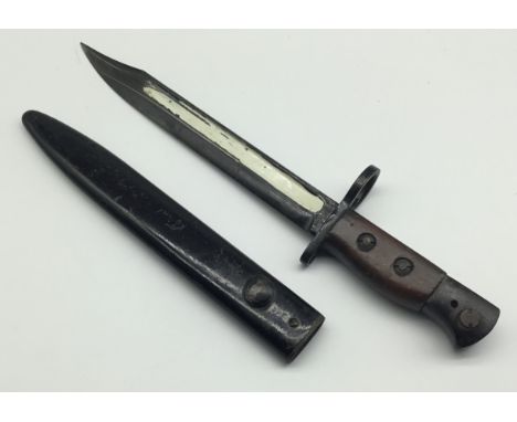 British No.5 MK1 Jungle Carbine bayonet, by the Wilkinson Sword Company. Complete with scabbard. Wrap around wooden slab grip