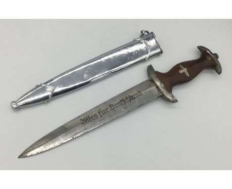 A WW2 era 1939 dated German SA dagger, with scabbard. Marked M7/94 at the ricasso for Gebrüder Bell. Usual etched motto of ‘A