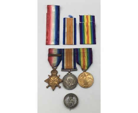 A WW1 1914 star trio, with sewn on clasp and silver war badge. Awarded to 2799 Dvr Edwin Arthur Fern of the 34th Brigade Roya