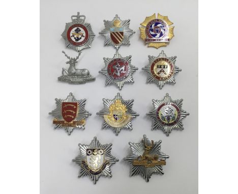 A selection of vintage chromed and enamelled fire service cap badges. To include: Hertfordshire Fire & Ambulance Control, Def