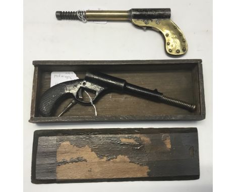 Late 1920s' variant of the highly collectable German Dolla pop-out action air pistol in an original box. The pistol is well-u