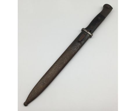 A pre WW2 German K98 bayonet, dated 1938 to the spine of the blade. Complete with wooden slab grips, blued pommel and blade, 