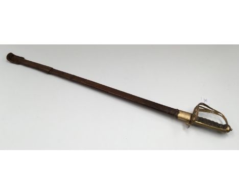 An 1892 pattern Edward VII Gothic hilt infantry officers sword, with leather field scabbard. Half basket hilt with Edward VII