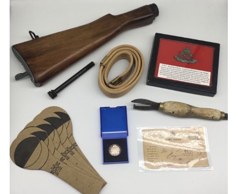 A selection of WW1 / WW2 military related items. To include: a Lee Enfield rifle stock, with retaining bolt (for attaching to