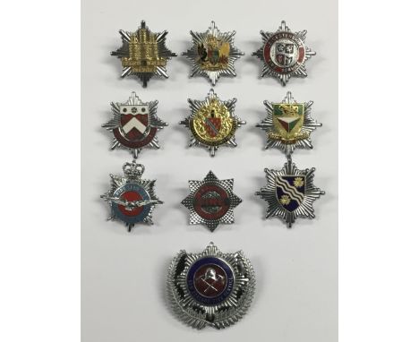 A good selection of vintage chromed and enamelled fire service cap badges. To include: Royal Air Force Department Fire Servic