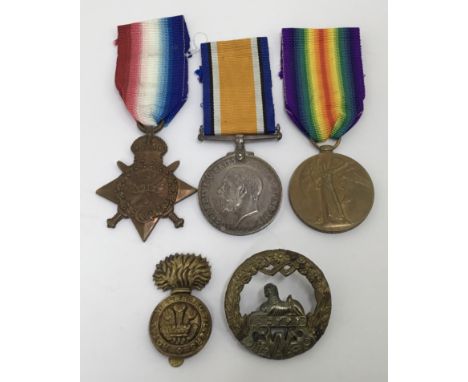 A WW1 1914 Star trio, and cap badge, awarded to 13260 Pte Ernest Bidmead of the South Wales Borderers. To include: the 1914 S