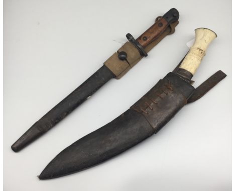 A WW2 era Indian SMLE bayonet, with scabbard and webbing frog. Marked GRI with a crown at the ricasso, plus MKII and 5.42, in