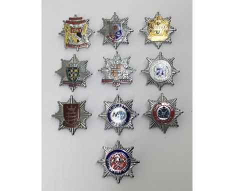 A good selection of vintage chromed and enamelled fire service cap badges. To include: Newcastle Airport, Hampshire Fire Brig