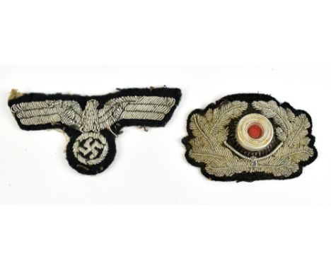 A German WWII Third Reich General Rank cloth breast eagle badge, width 9cm, and a cloth army officer's cap cockade, width 6.5