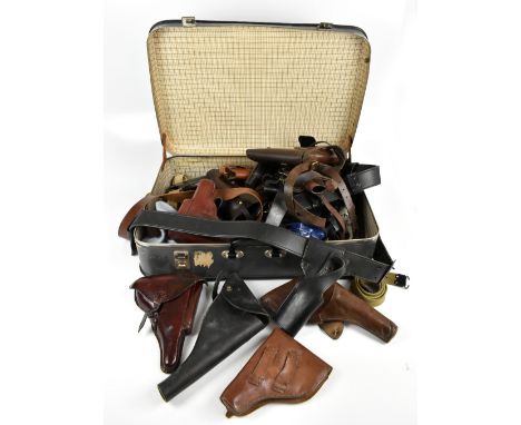 A quantity of leather holsters including belted examples and a R. W. Stiby 1918 Lancashire Police holster, etc.