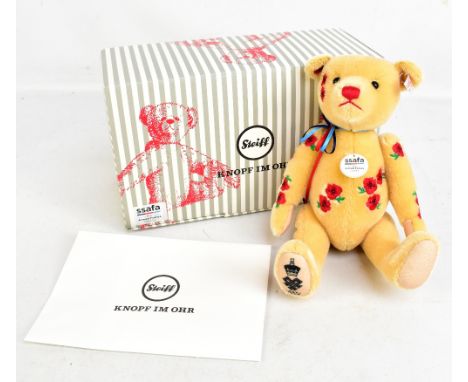 STEIFF; a boxed no.186 Armistice teddy bear with button-in-ear, SSAFA armed forces charity tag, certificate and information c