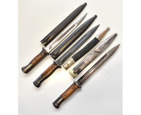 F. HERDER; a WWI period Walter &amp; Co bayonet and scabbard, length 40.5cm, two further bayonets and scabbards, one with imp