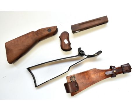 Two handgun stock attachments including a stained wooden example with leather fasteners, length 35cm, also a wooden stock and