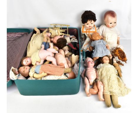 A collection of dolls for restoration, including a wax head shoulder example with blonde pigtails, inset blue glass eyes, con