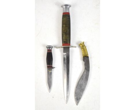 A hunting knife with painted steel hilt, length 25.5cm, and two smaller associated knives, in leather scabbard.Additional Inf