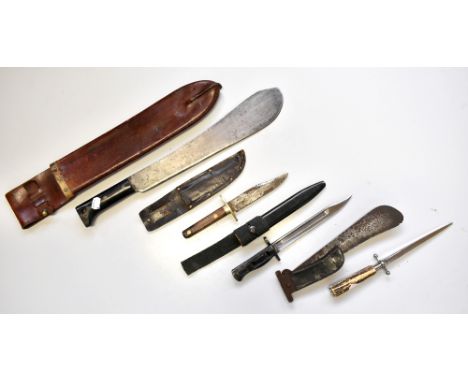 A group of knives and bayonets including a British L1 A3 9600257 D62 example with blackened sheath, length 30cm, a Legitimus 