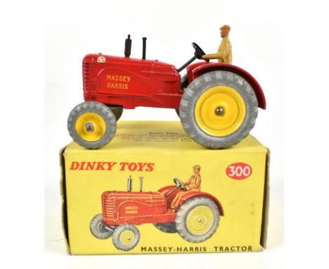 DINKY; a boxed 300 Massey-Harris Tractor with driver.Additional InformationSome chips to paint, box very worn with tears in n